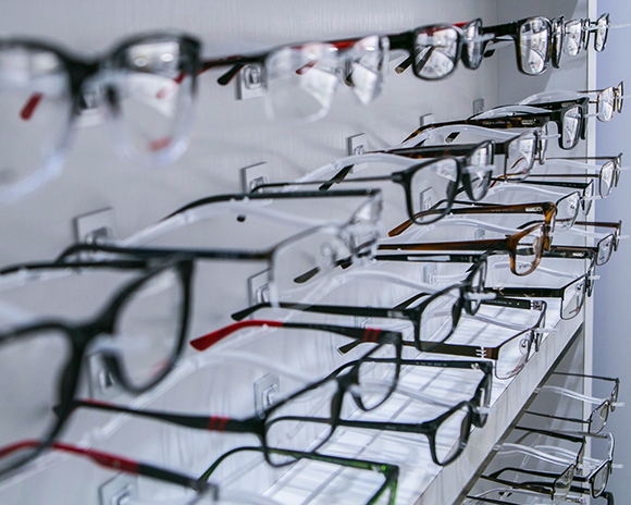 A display wall of eyeglass frames in the optical shop
